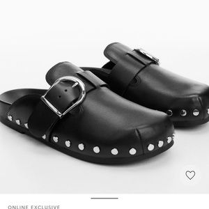 Black leather studded clogs